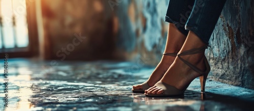 tired business woman takes off her shoes after a long day swelling of feet after high heels soft focus Selective focus. Creative Banner. Copyspace image photo