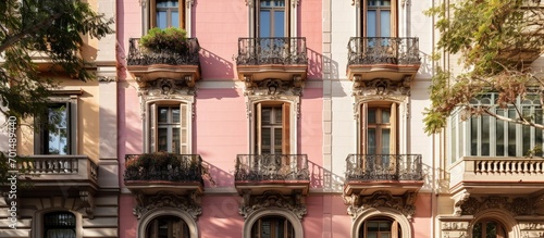 The pastel colored facade of a building in Barcelona adds a touch of charm and elegance to the city s architectural landscape. Creative Banner. Copyspace image