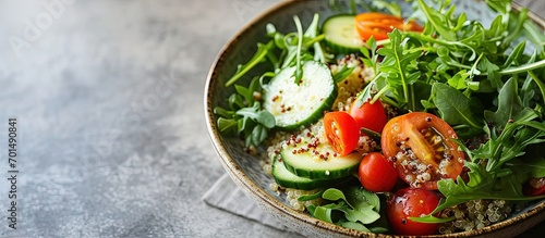 Quinoa salad with fresh tomatoes cucumbers and salad leaves. Creative Banner. Copyspace image