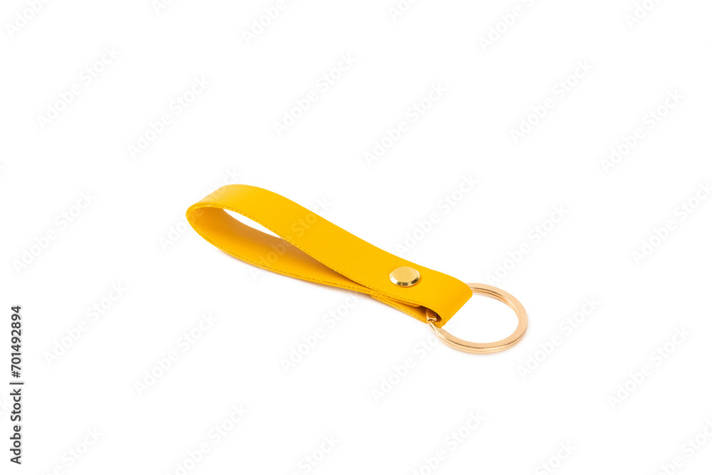Leather keychain with key ring isolated on white background. Concepts for real estate and moving home or renting property. Buying a property. Mock-up keychain.Copy space.