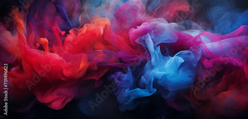 Cascading bursts of ruby and indigo-colored smoke intertwining in a captivating and colorful dance against a dark backdrop.