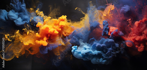 Explosive clouds of goldenrod and indigo smoke intertwining, creating a mesmerizing explosion of color against a dark canvas.