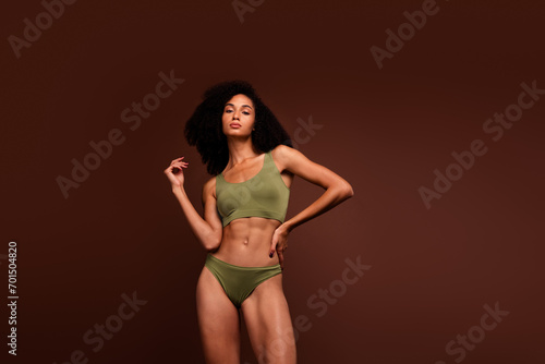 No retouch photo of stunning girl perfect flawless body natural beauty self and health care empty space isolated on brown color background © deagreez