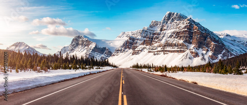 Fototapeta Naklejka Na Ścianę i Meble -  Road with Canadian Rocky Mountain Peaks Covered in Snow. Banff