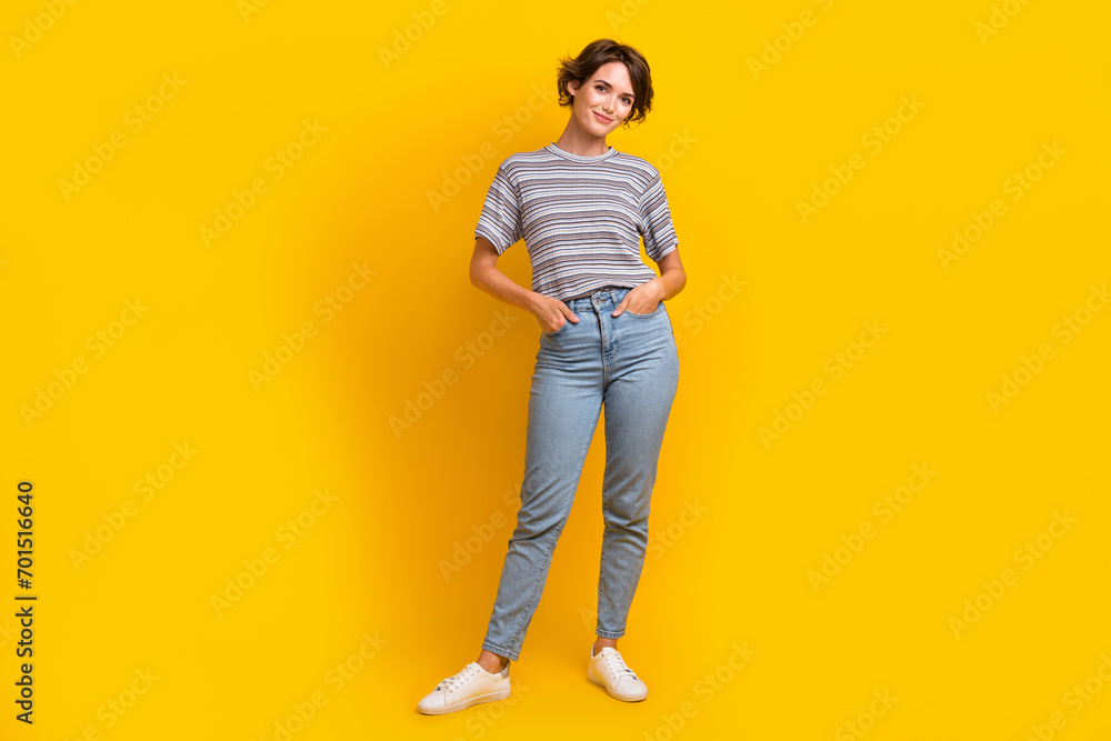 Fototapeta premium Full length photo of positive glad woman posing in stylish clothes new summer spring collection isolated on yellow color background