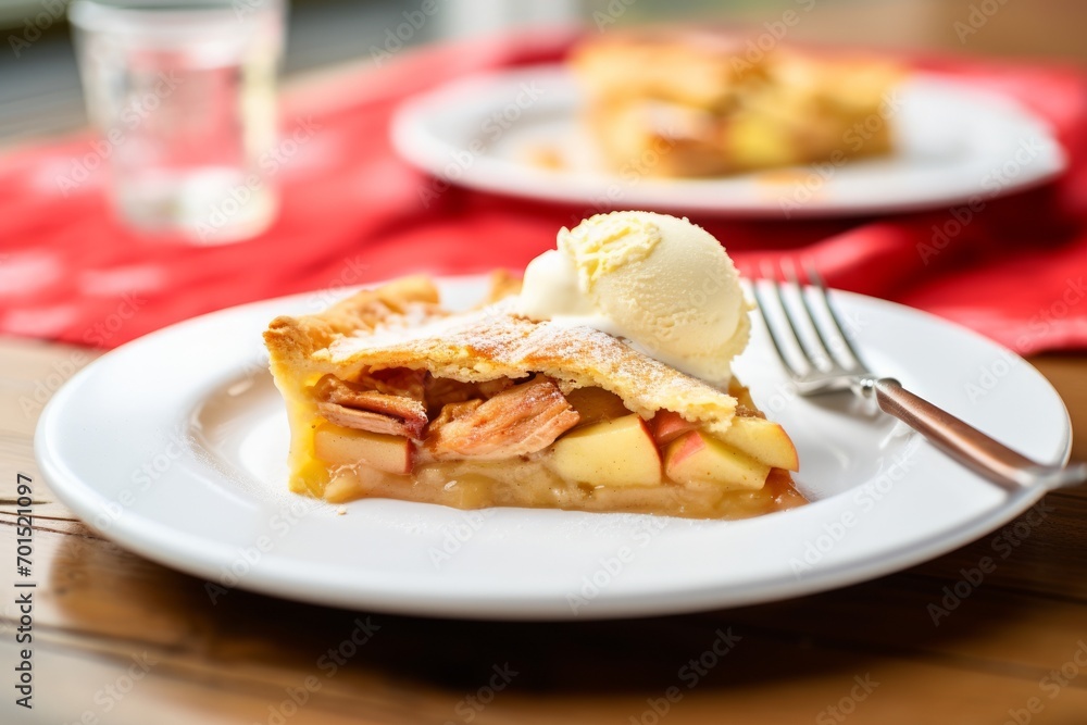 A delicious piece of apple pie served with a scoop of vanilla ice cream. A delicious piece of apple pie served with a scoop of vanilla ice cream.