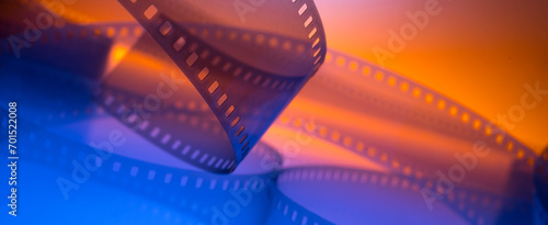 multicolored cinema background with film strip photo