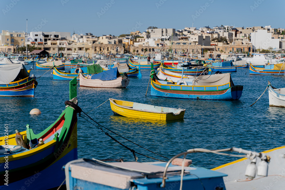 Multi-colored fishing boats. Malta. Overall plan.