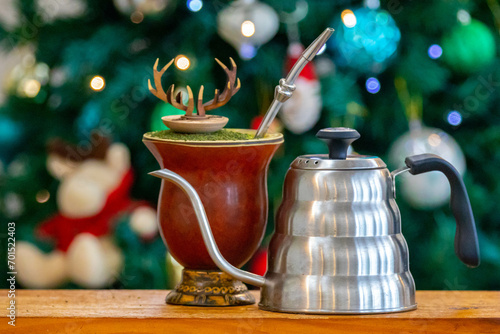 Traditional chimarrão prepared with amate herb (Ilex paraguariensis) in a Christmas atmosphere photo