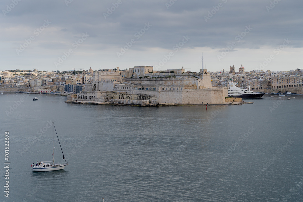Malta. The yacht sails against the backdrop of the old city of Valletta. Overall plan.