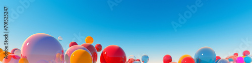 Colorful shapes floating like balloons against a clear blue sky.