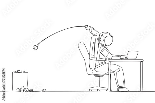Single continuous line drawing astronaut typing at a work desk throwing wads of paper into trash. Creating scientific journal of space expeditions that always fail. One line design vector illustration