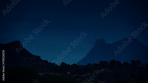 Timelapse of night is falling over Peak Puig Campana. Alicante province, municipality of Finestrat. View from Xarco coast. photo