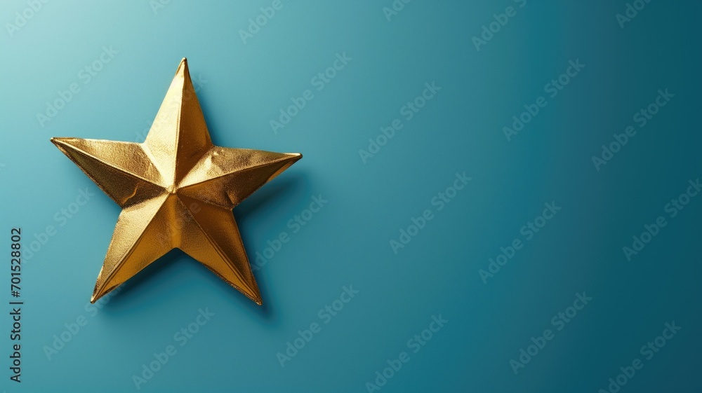 Golden star ornament on a teal background with space for text Golden star ornament on a teal background with space for text