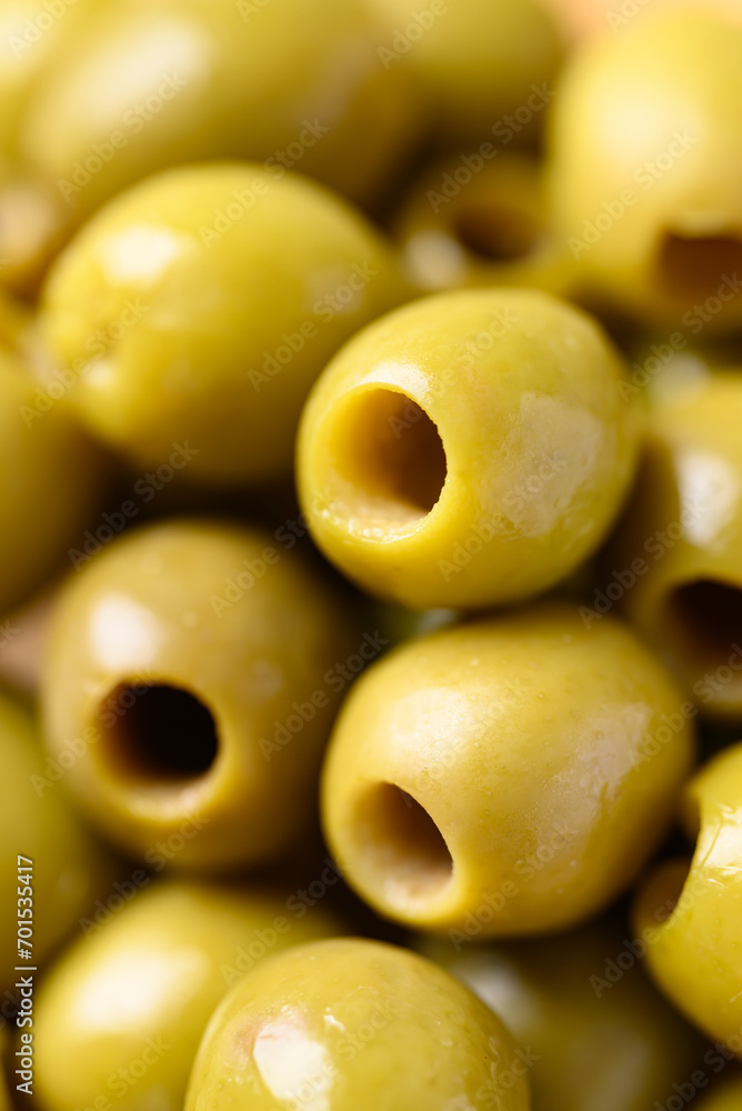 Pickled olives, Pitted green olives texture background Pickled olives, Pitted green olives texture background