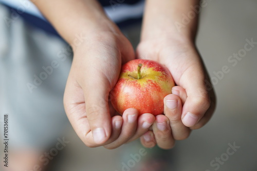 Human hand holds fresh apple