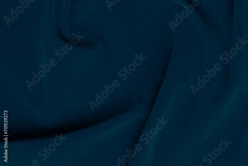 Dark blue velvet fabric texture used as background. silk color denim fabric background of soft and smooth textile material. crushed velvet .luxury navy blue dark tone for silk.