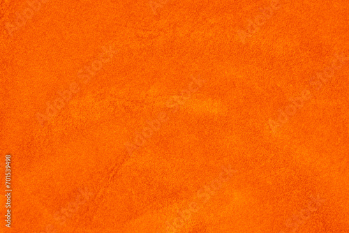 light orange velvet fabric texture used as background. silk color saffron fabric background of soft and smooth textile material. crushed velvet .luxury sun light tone for silk. photo