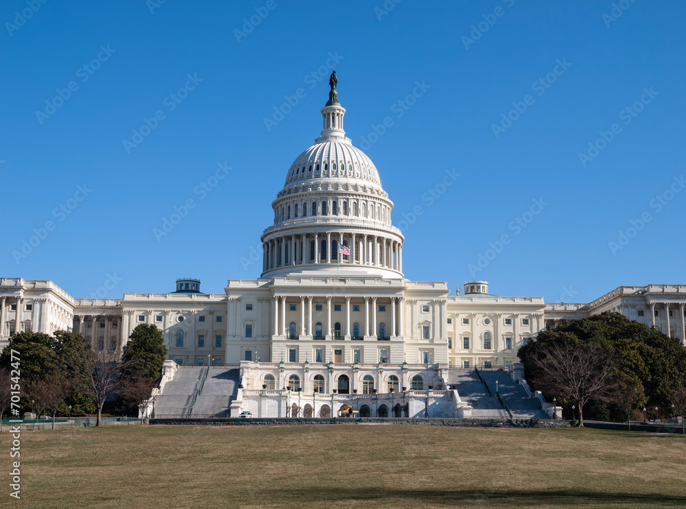 United States Capitol building in Washington DC with clear blue sky.