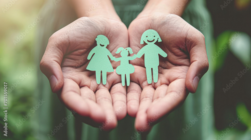 hands holding paper family cutout, family home, foster care, world mental health day, Autism support,homeschooling, budgeting cost of living, inflation concept hands holding paper family cutout, family home, foster care, world mental health day, Autism support,homeschooling, budgeting cost of living, inflation concept
