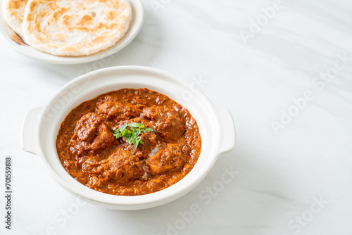 chicken tikka masala spicy curry meat food with roti or naan bread © topntp