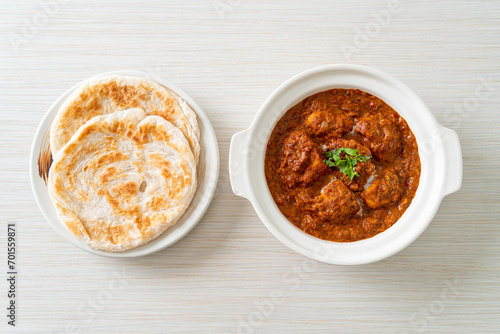 chicken tikka masala spicy curry meat food with roti or naan bread