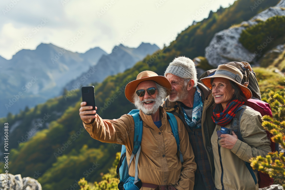 old hiking couple taking selfie on mountain top