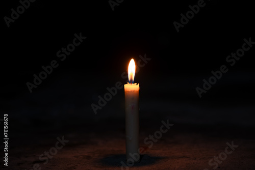 candles in the dark, flame of a candle burning in the dark