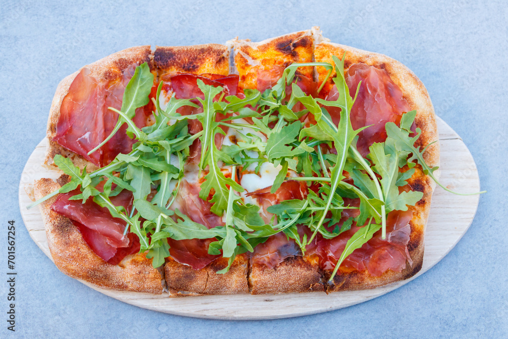 Tasty pinsa on a table. Top view Tasty pinsa on a table. Top view