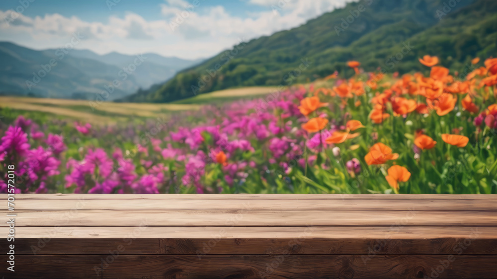 Fototapeta premium Tulips in the mountains, Flowers on a table, Flowers in the mountains, Empty wood table top on blur of abstract green from the garden. For the montage product display, a wooden table with a garden