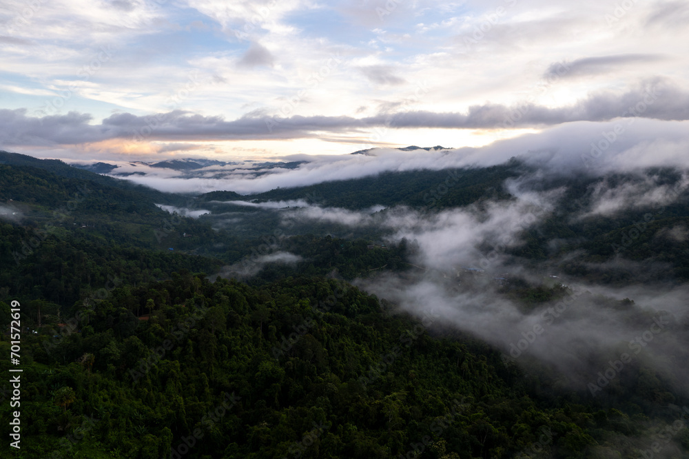 Top view Landscape of Morning Mist with Mountain Layer at north of Thailand. mountain ridge and clouds in rural jungle bush forest Top view Landscape of Morning Mist with Mountain Layer at north of Thailand. mountain ridge and clouds in rural jungle bush forest