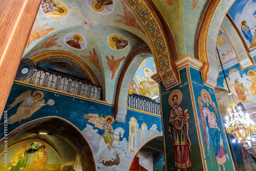 Pillar wall and ceiling painted with religious themes in main hall of Greek Orthodox Church of Annunciation in the Nazareth old city in northern Israel