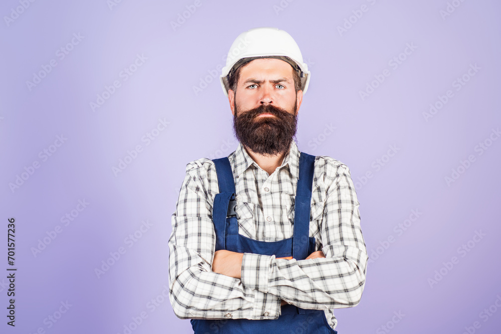 Builder in hardhat. Builder with helmet. Worker builder in helmet at building. Portrait of Builder with helmet and uniform.