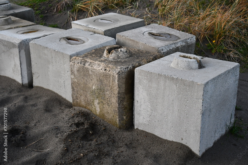 Concrete blocks sitting in the sand. Concrete blocks sitting in the sand.