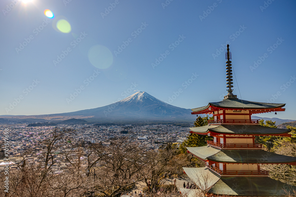 panoramic view with city and snow mountain Fuji and green trees red pagoda in foreground