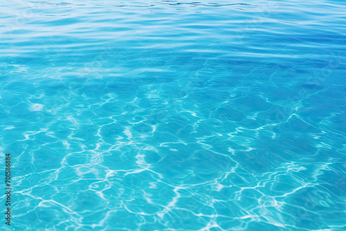 Calm clear blue sea water background. Blue azure sea water texture. © ebhanu
