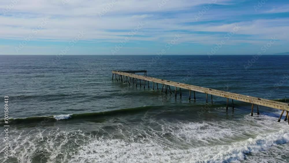 Aerial tilt shot rising over the Pacifica Municipal Pier in sunny California, USA Aerial tilt shot rising over the Pacifica Municipal Pier in sunny California, USA