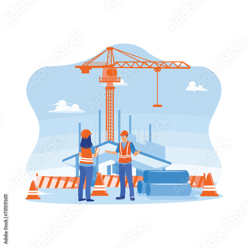 Construction engineer talking with the manager at a construction site. Check work processes, building quality, work plans, and home and industrial building design projects. Architect and engineer cons
