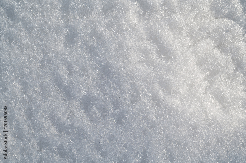 white texture of snow on a snowdrift on a cold winter day
