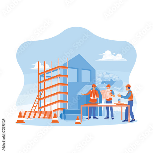 Three construction experts inspect the construction of a real estate project. Civil engineers, architects, business investors and general staff are discussing details of building plans. 