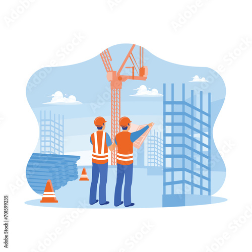 Civil architect engineer holding blueprint standing at the construction site. Inspect and work on building places of outdoor structures. Construction site engineer concept.