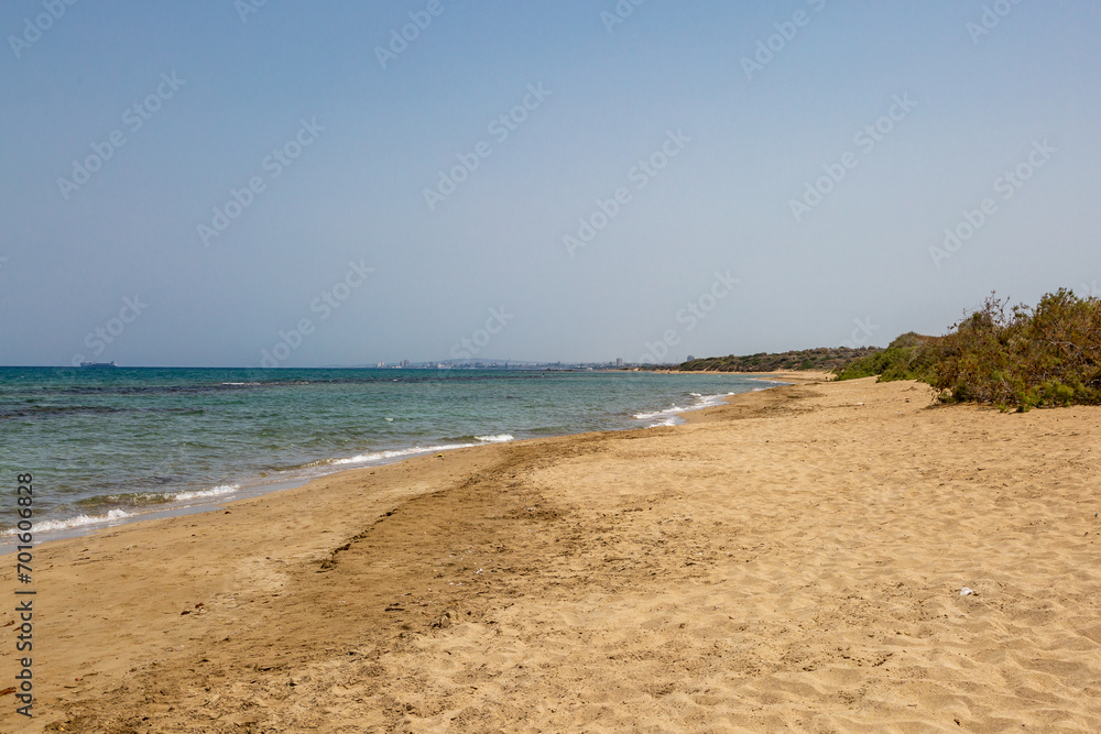 The beach at Salamis on the Island of Cyprus, with a blue sky overhead
