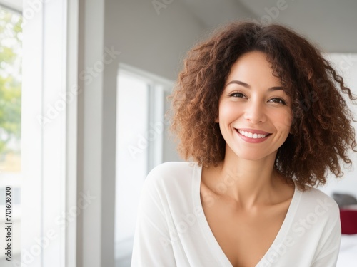 Cheerful Woman with Mid-Length Brown Wavy Hair Smiling Brightly