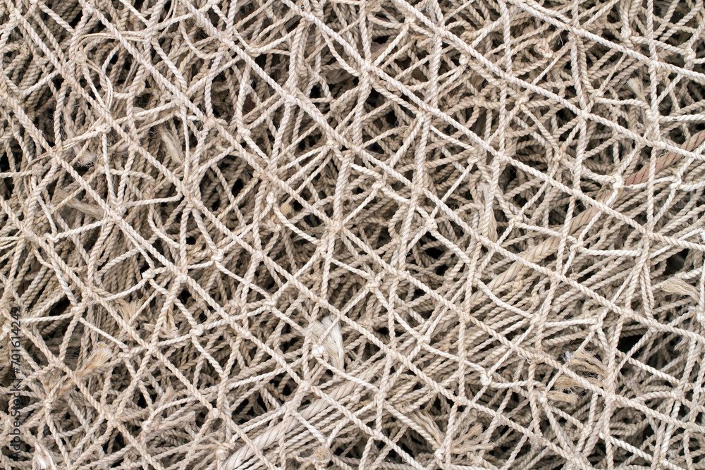 Old fishing net close-up. Texture of an old fishing net. Old fishing net close-up. Texture of an old fishing net.