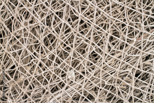 Old fishing net close-up. Texture of an old fishing net.