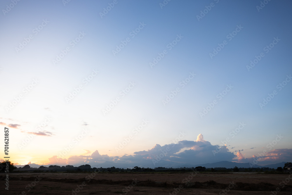 Beautiful sky and cloud at high. Landscape include space, light of nature, sunset, sunrise, horizon or skyline. Colorful with yellow, orange and blue at evening in autumn for background and wallpaper.