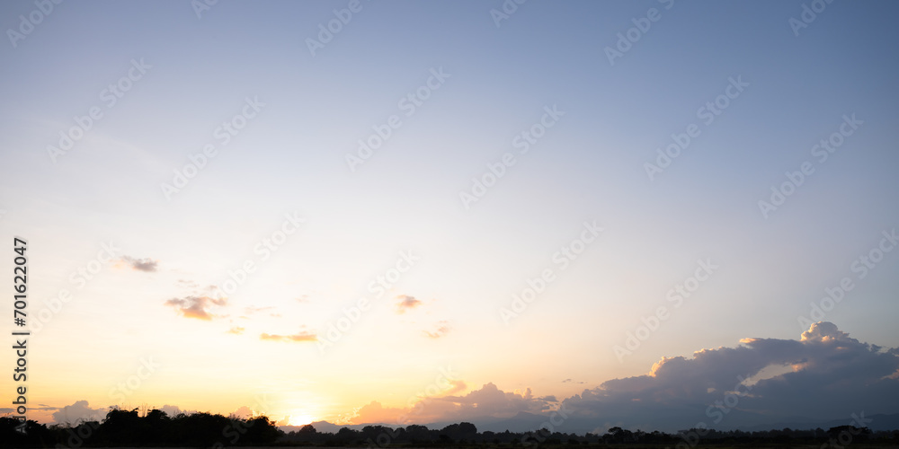 Beautiful sky and cloud at high. Landscape include space, light of nature, sunset, sunrise, horizon or skyline. Colorful with yellow, orange and blue at evening in autumn for background and wallpaper.