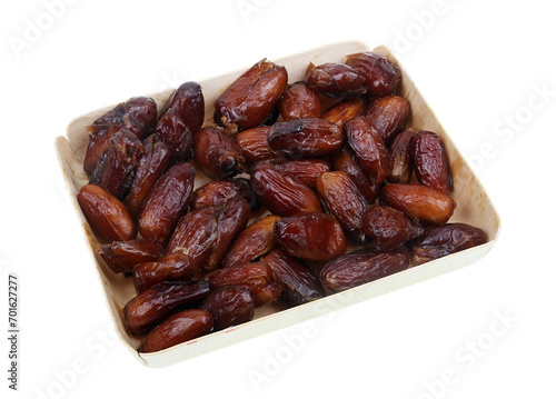 Dried sweet Egyptian dates in a box isolated