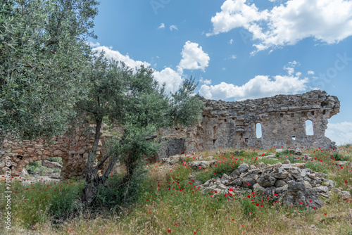 Ancient settlements and places of worship around Lake Bafa with different rock forms and religious drawings photo