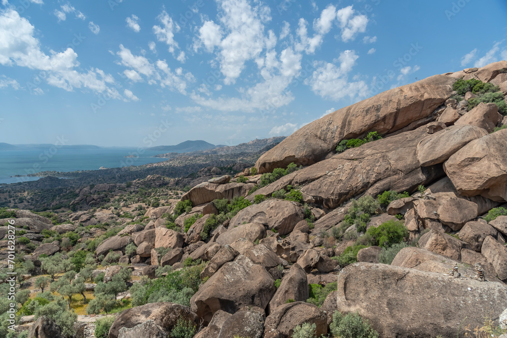Naklejka premium Ancient settlements and places of worship around Lake Bafa with different rock forms and religious drawings